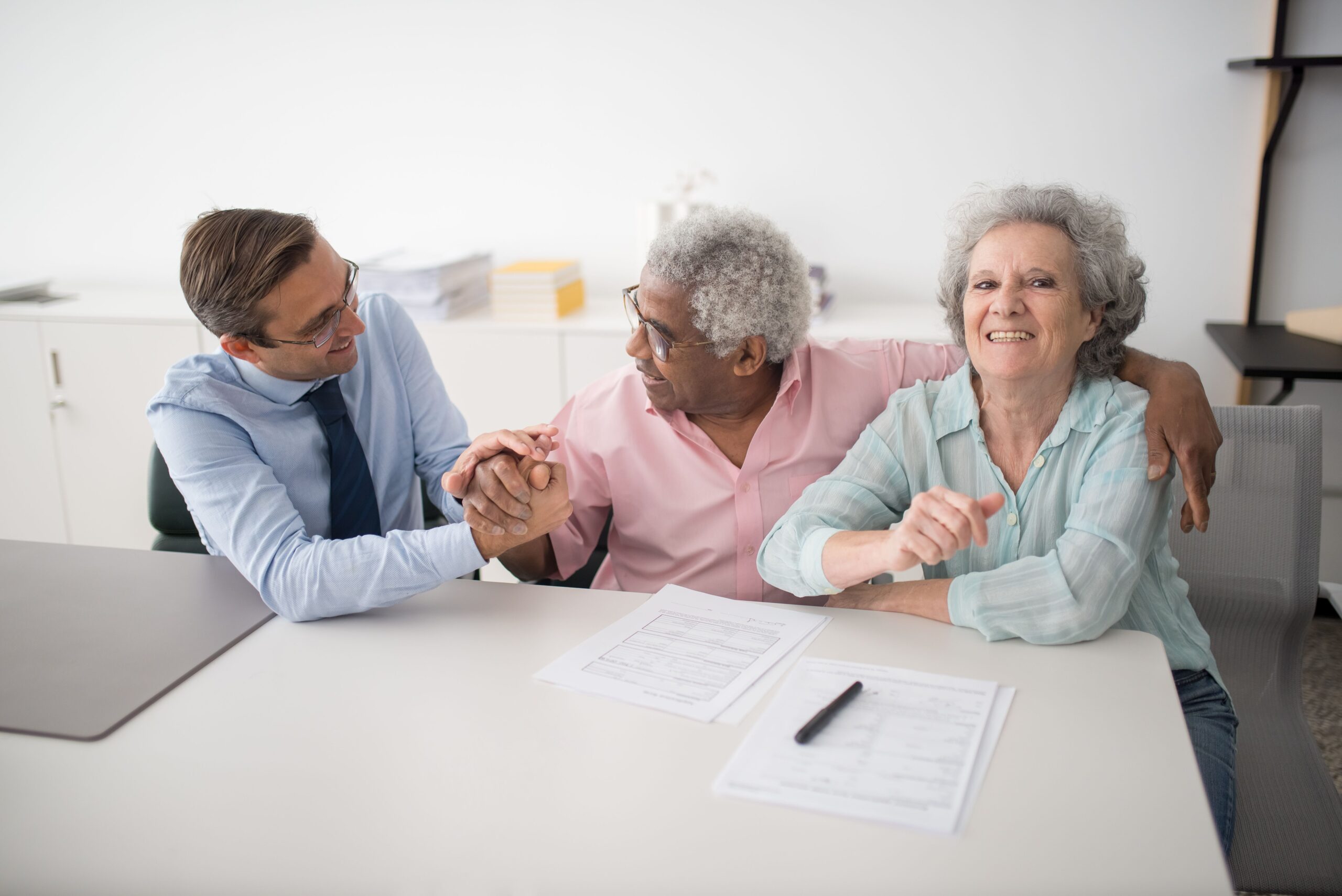 Couple meeting with a financial advisor to apply together for long-term care insurance