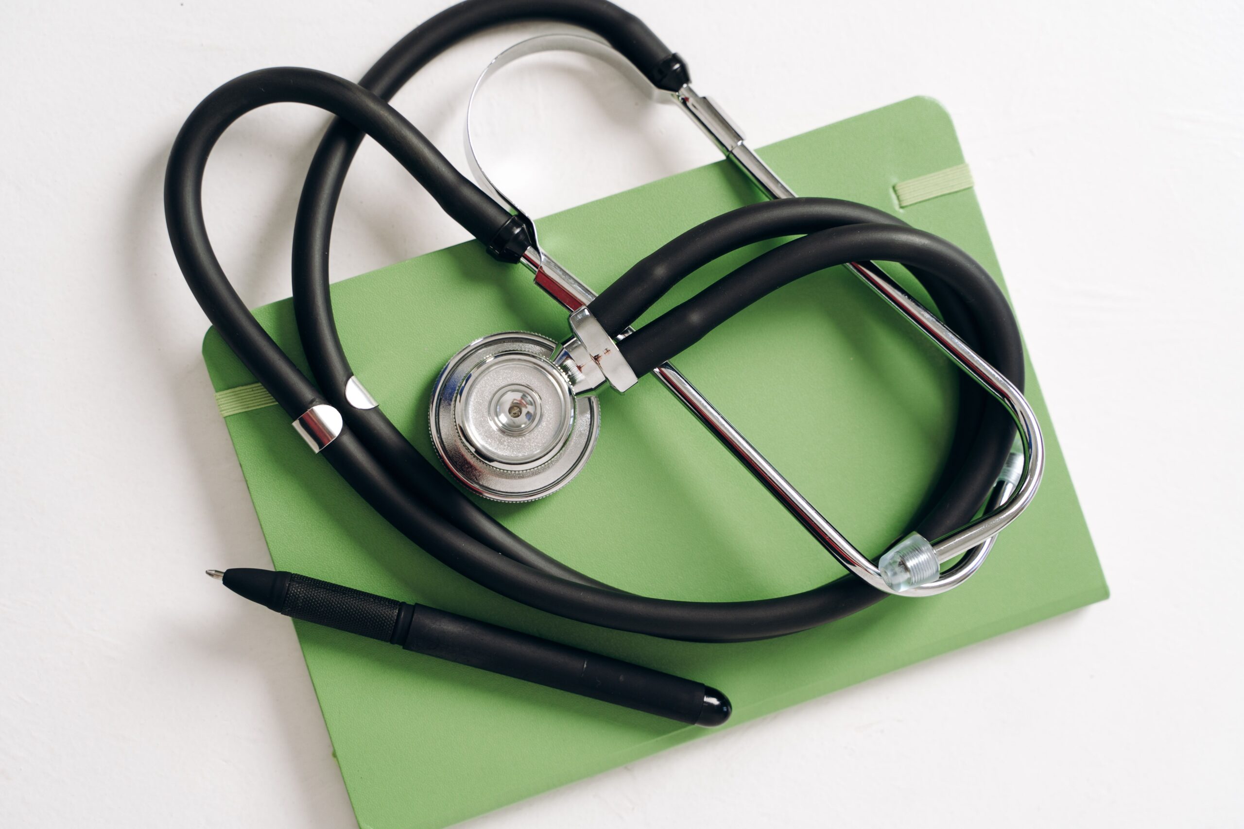 Insurance application form and stethoscope representing long-term care insurance underwriting