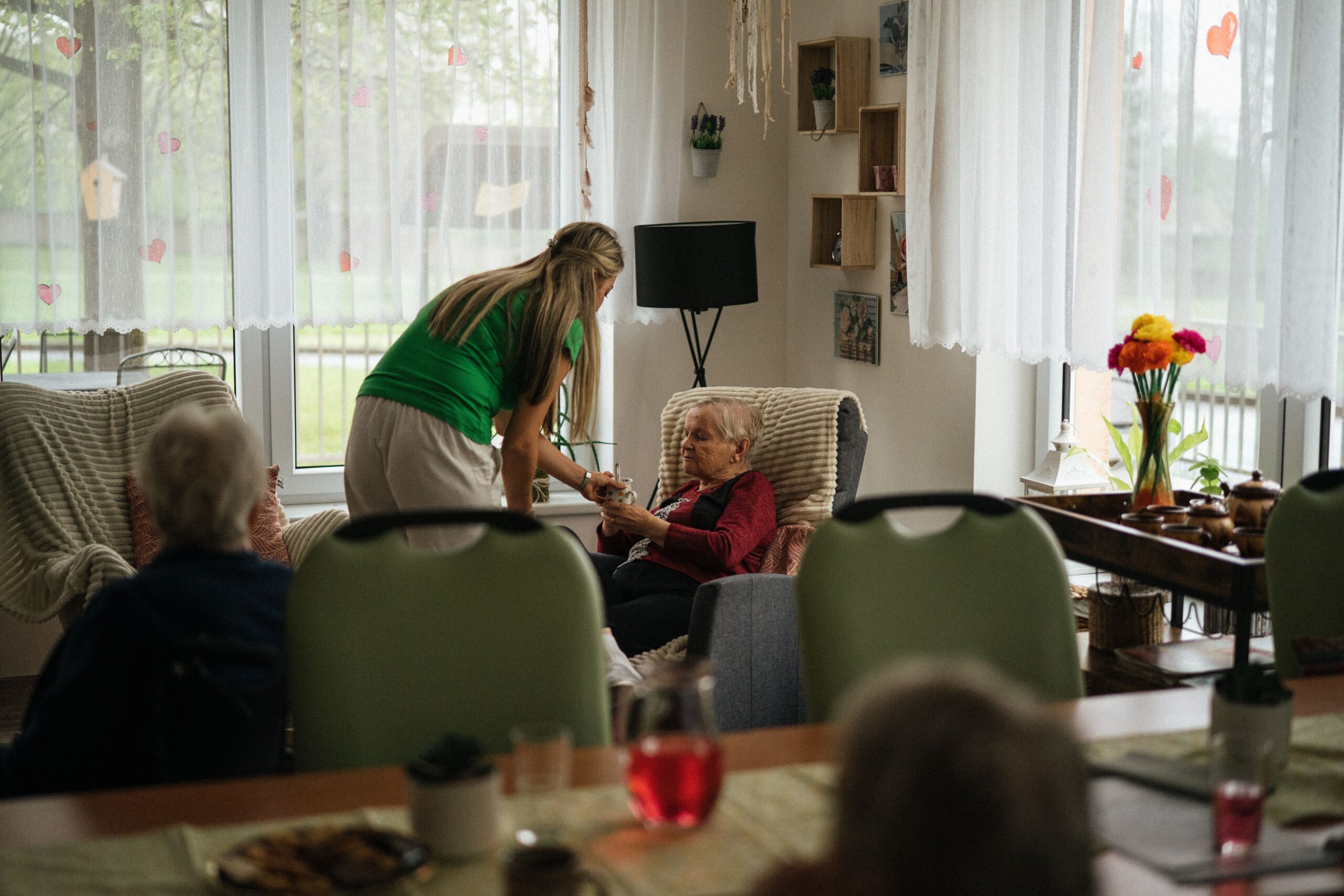 Older woman receiving assisted living care, representing the majority of long-term care residents