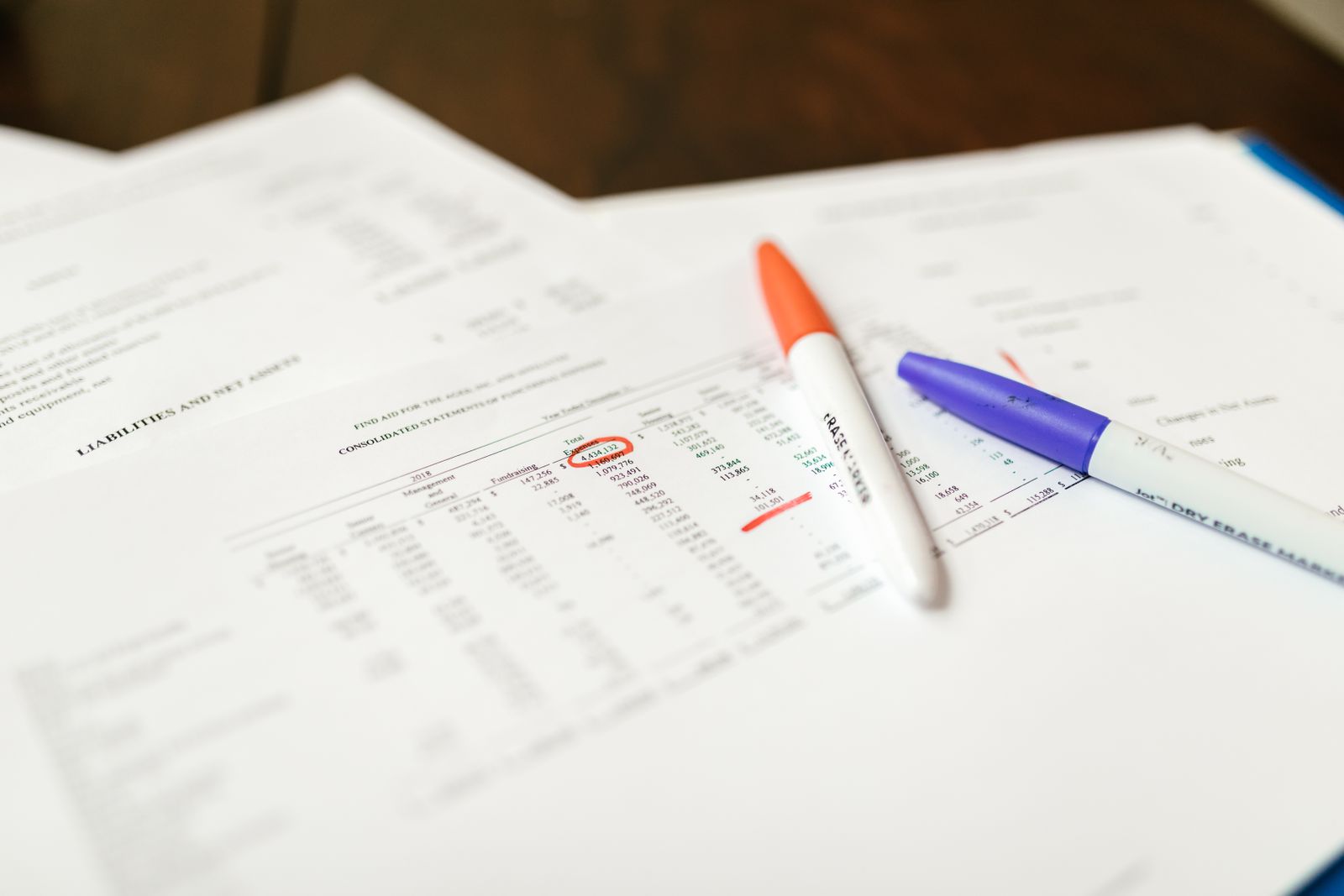 Insurance illustration documents comparing benefit reduction options side by side