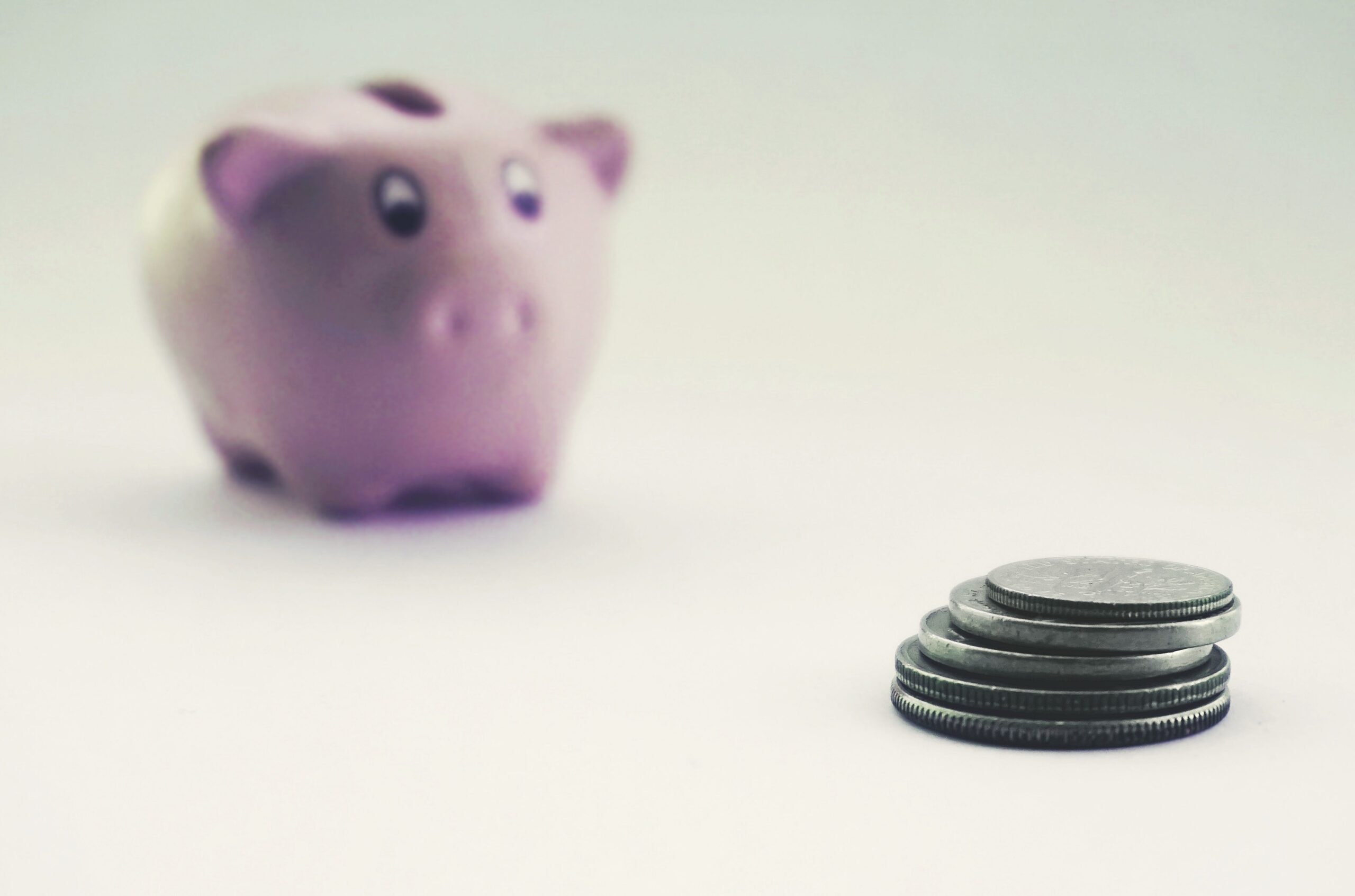 Piggy bank with coins, representing long-term care insurance cost and pricing